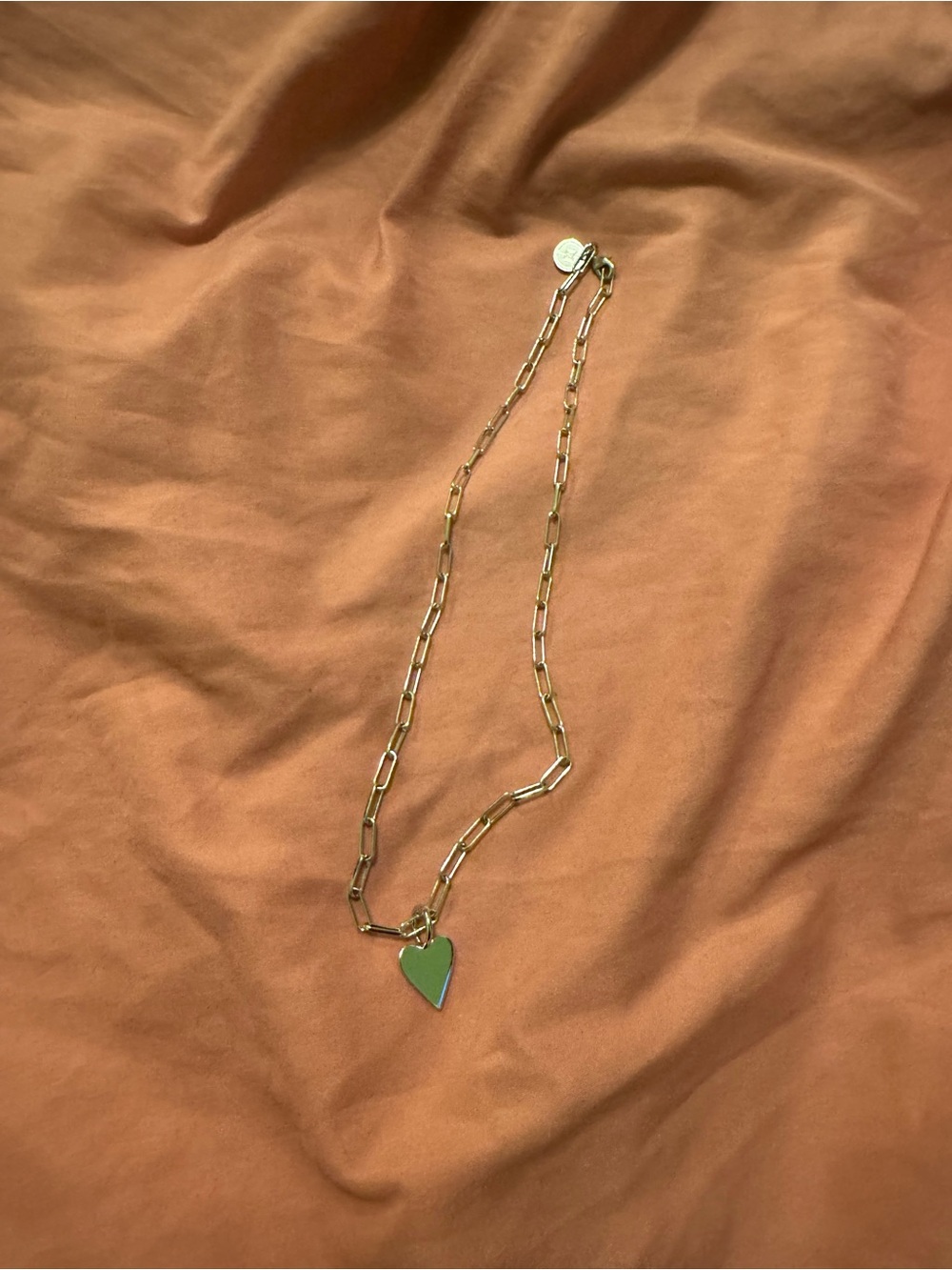 Eklexic brand sterling silver paper clip chain with heart pendant.